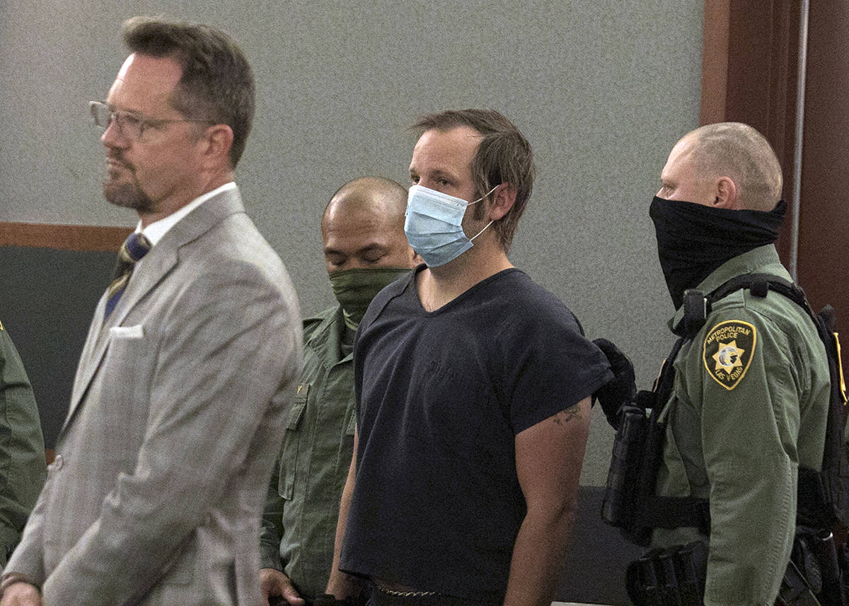 Stephen Parshall, center, one of three alleged Boogaloo Boys extremists charged with planning v ...