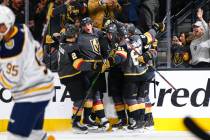 Golden Knights players celebrate a goal by Reilly Smith during the third period of an NHL hocke ...