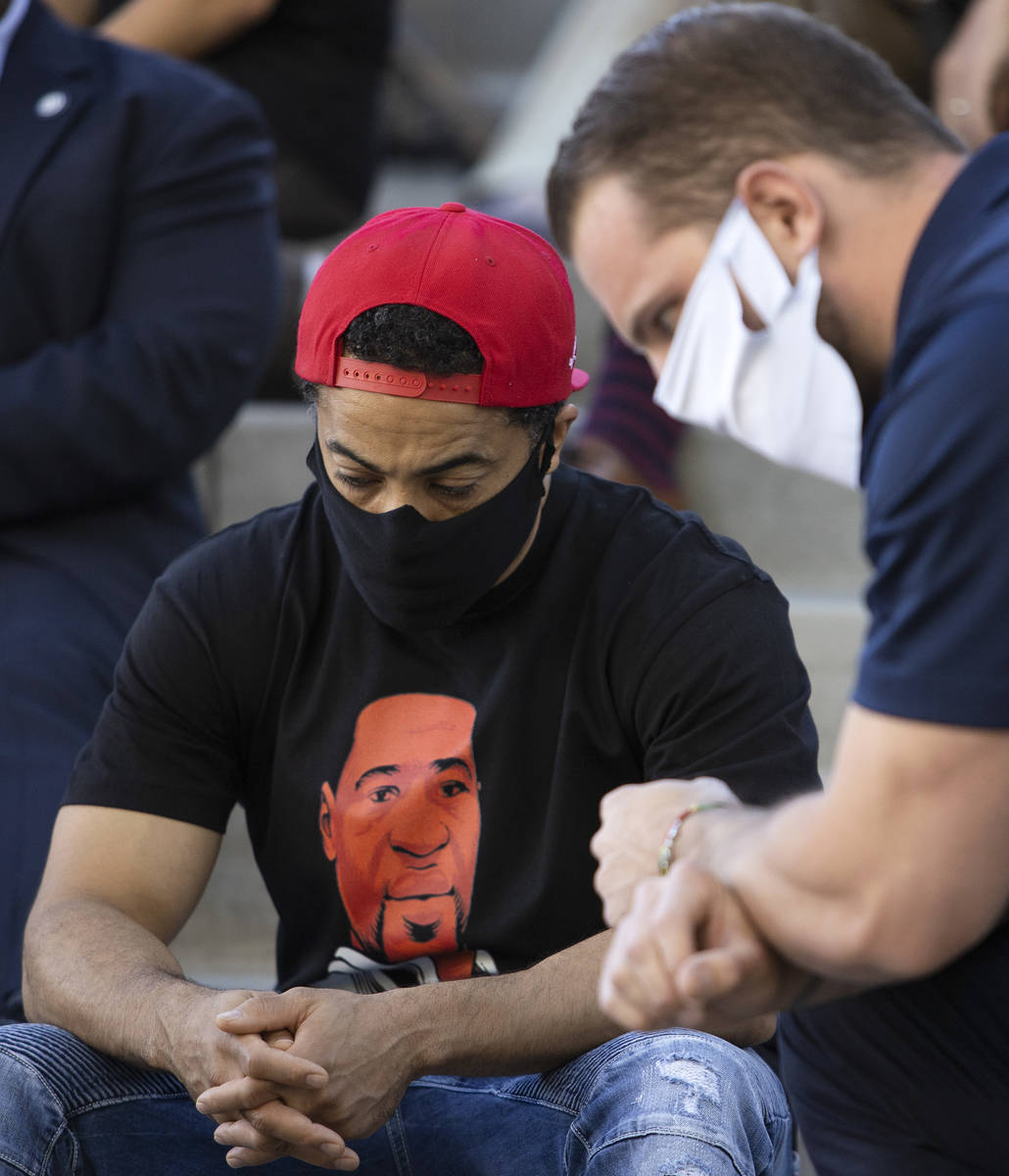 William Covington, left, and Brandon Monson, right, participate in an 8-minute, 46-second momen ...