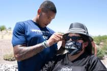 The Las Vegas Raiders tight end Darren Waller signs an autograph for Cynthia Ie, of Las Vegas, ...