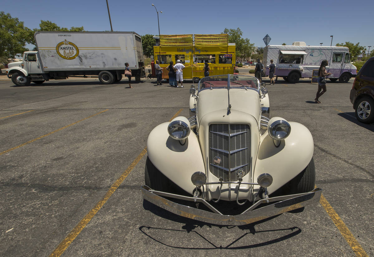 A 1935 Auburn Boattail Speedster is parked near the Hot Diggity Dog Las Vegas and Spoon-a-Bowl ...