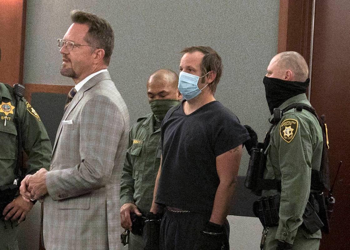 Stephen Parshall, center, one of three alleged boogaloo movement extremists charged with planni ...