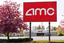 This May 14, 2020, photo shows an AMC theater sign at a nearly empty parking lot for the theate ...
