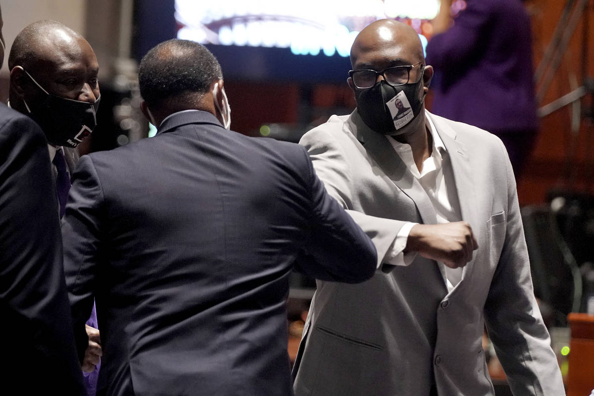 Philonise Floyd, brother of George Floyd, elbow bumps Rep. Steven Horsford. D-Nev., during a br ...