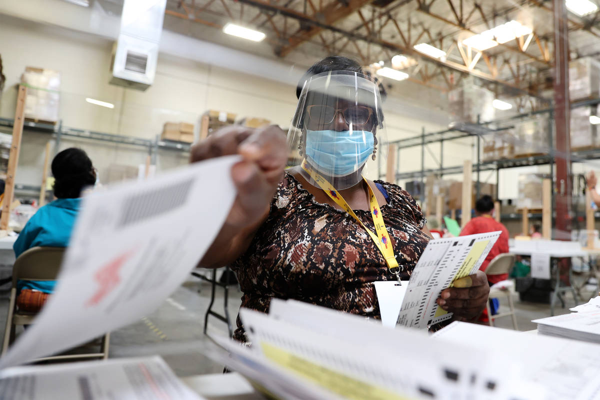 Barbara Lewis verifies ballots at the Clark County Election Department in Henderson, Wednesday, ...