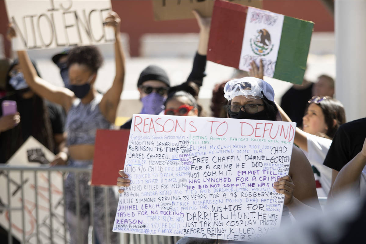 Demonstrators gather outside Las Vegas City Hall in an effort to defund the Las Vegas Metropoli ...