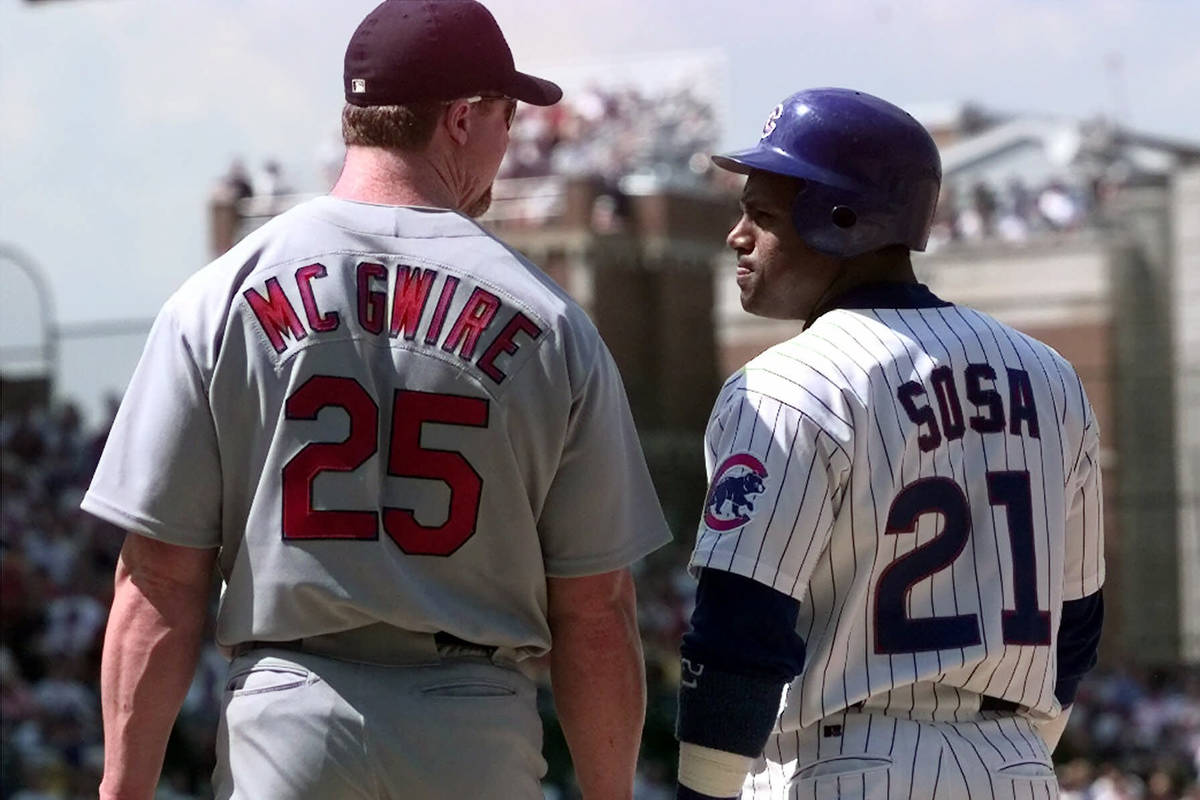 FILE - In this May 28, 1999, file photo, Chicago Cubs' Sammy Sosa, right, and St. Louis Cardin ...