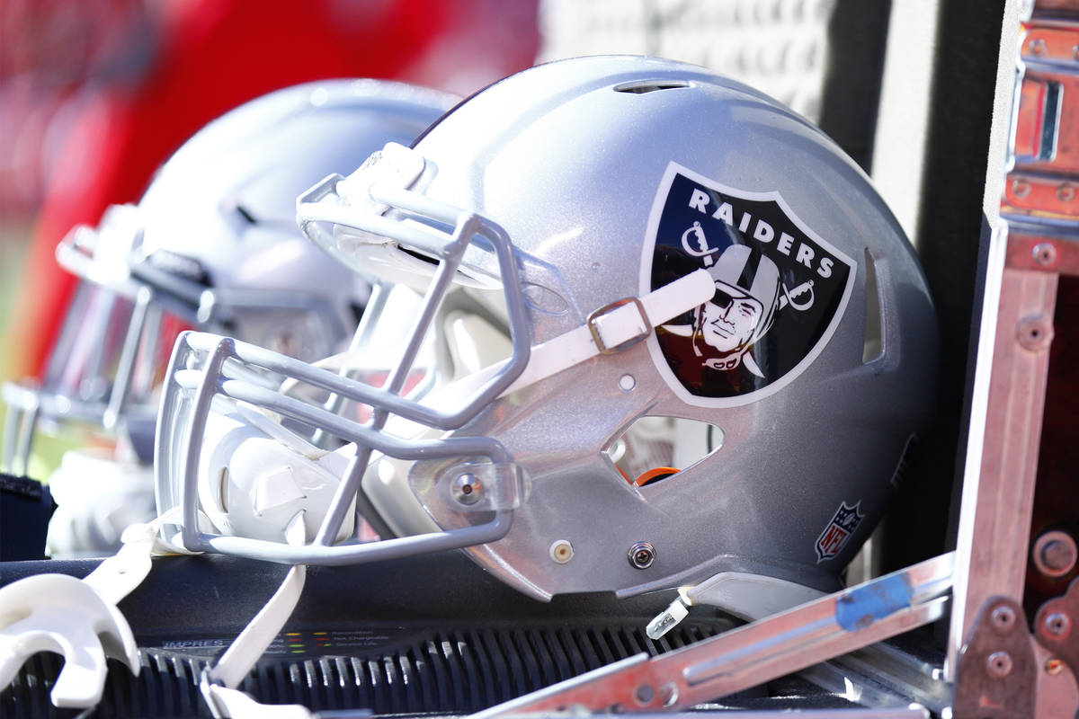The Oakland Raiders helmets lay in an equipment box on the team's sideline during the first hal ...