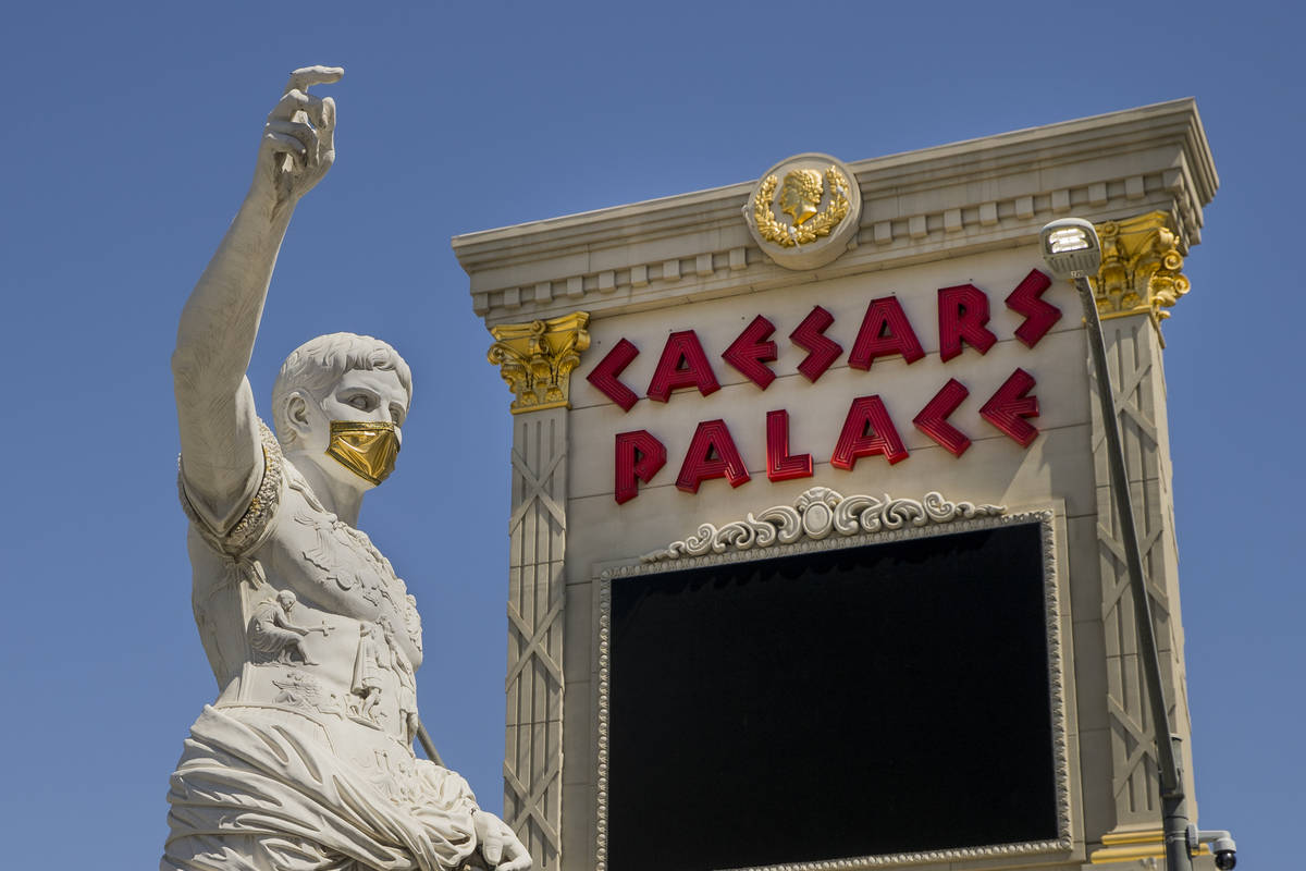 Caesar welcomes all out front while wearing a golden face mask following re-opening ceremonies ...