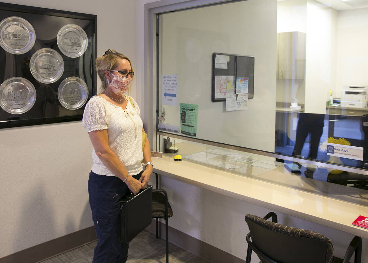 Molley Taylor, Expel Michele organizer, waits for Stacey Campbell, chief deputy clerk at the Ci ...