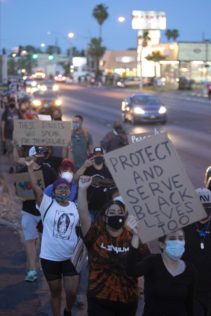 A protest against police brutality moves from Molasky Family Park to the Las Vegas Convention C ...