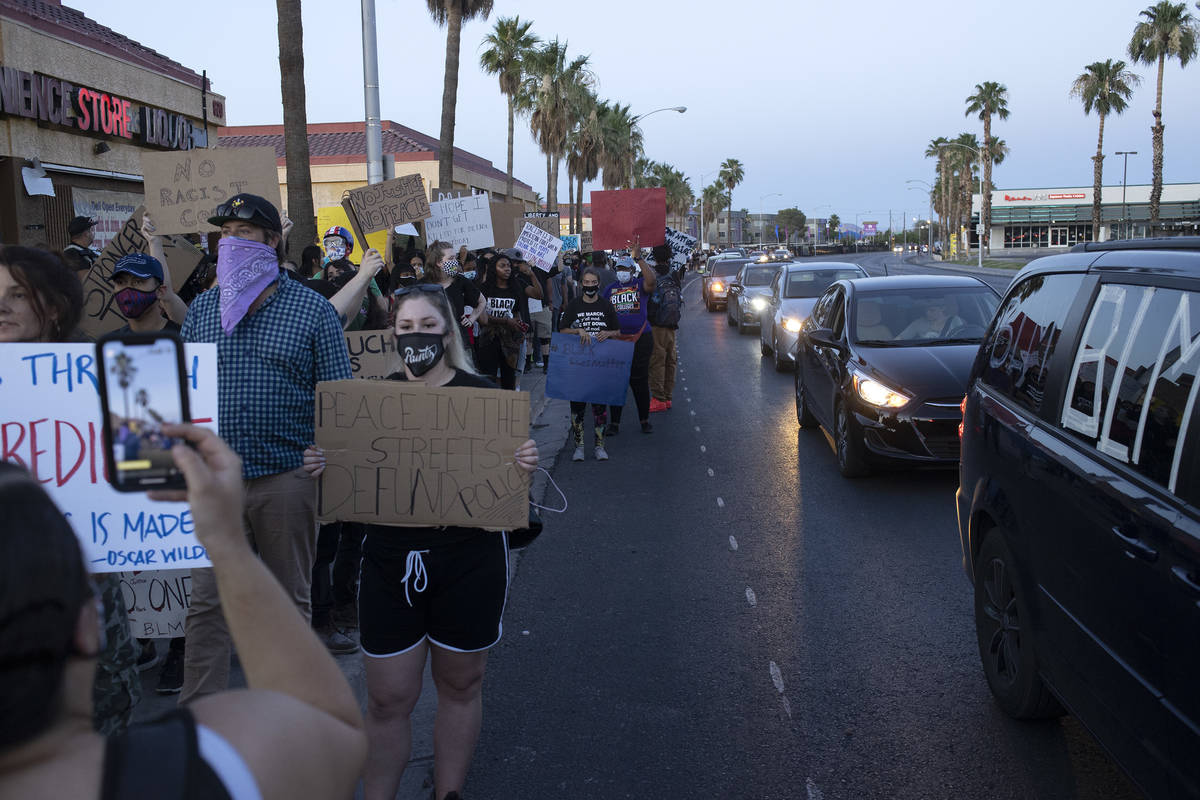 Protesters march against police brutality from Molasky Family Park to the Las Vegas Convention ...