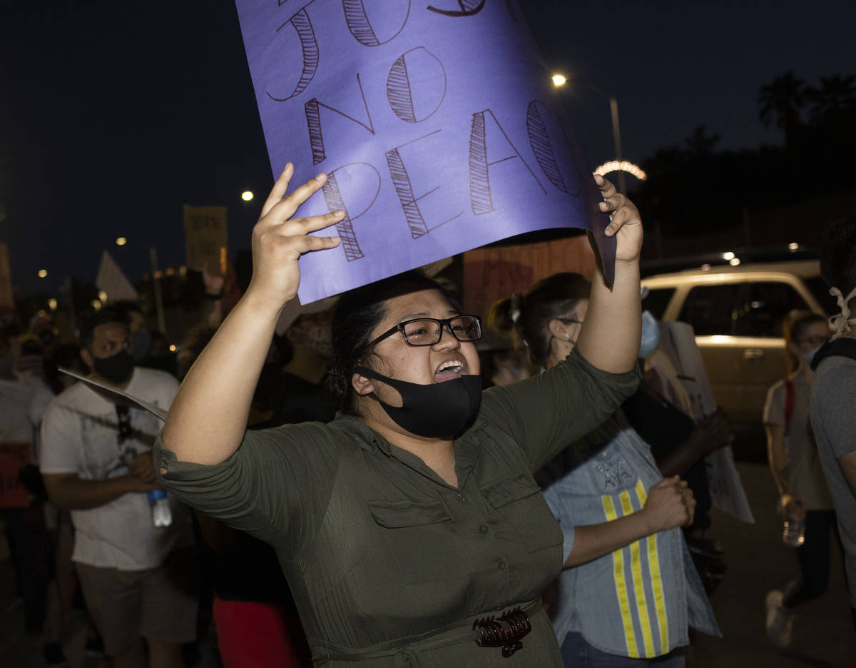 Andrea Lopez leads a chant of "black lives matter" as protesters reached the Las Vega ...