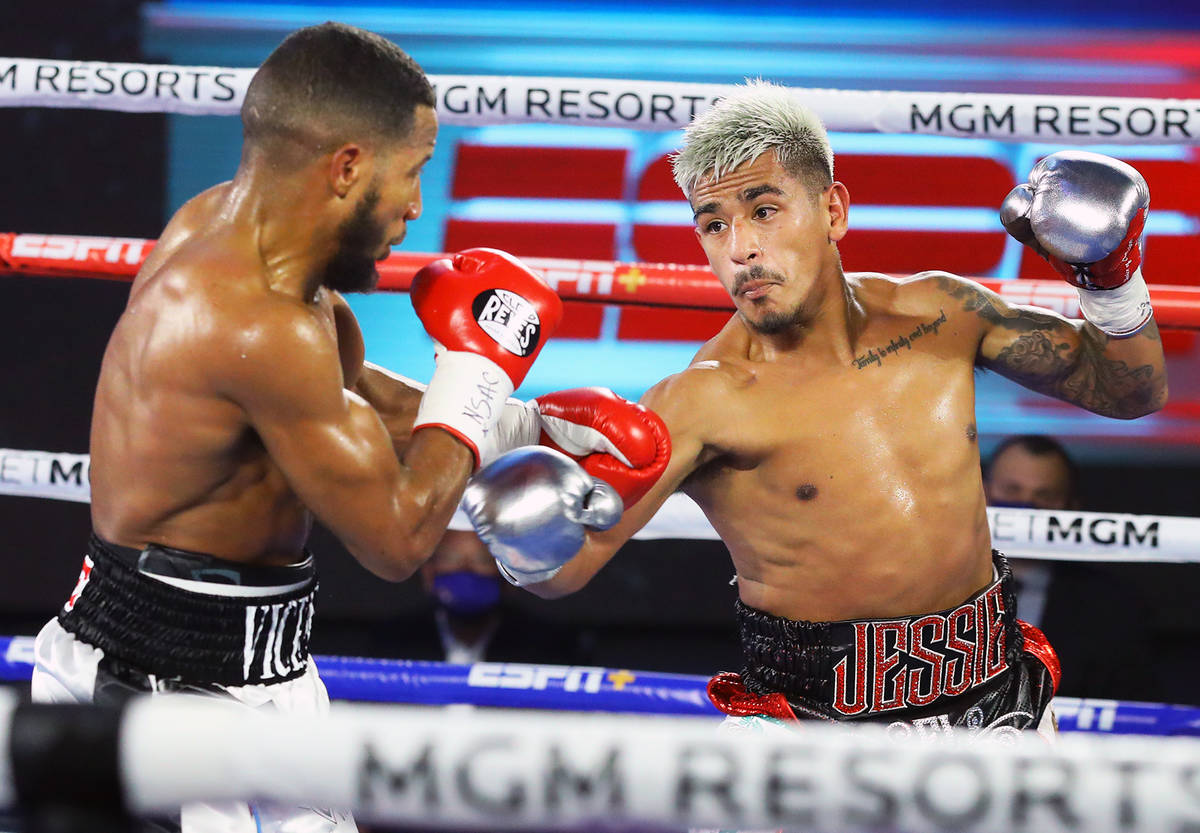 Jessie Magdaleno, right, prepares to throw a left punch against Yenifel Vicente during their fe ...