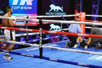 Jessie Magdaleno is attended to after taking a low blow from Yenifel Vicente in the fourth roun ...
