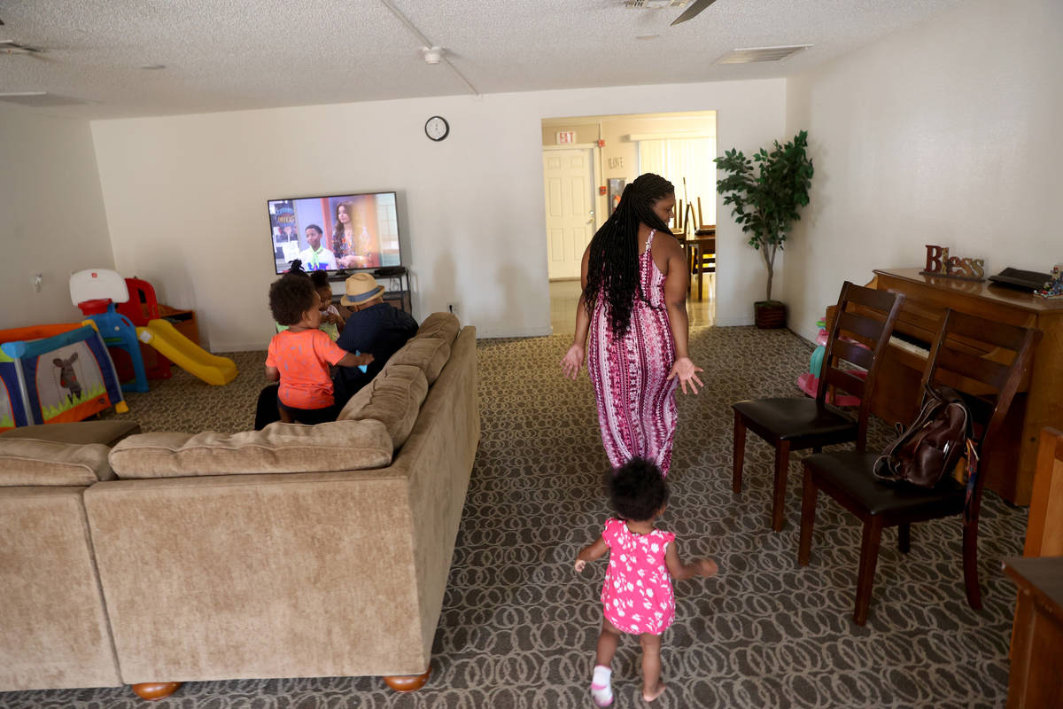 Tytaliayah Parker plays with one of her five unidentified foster siblings at St. Jude's Ranch f ...