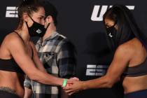 UFC flyweights Jessica Eye, left, and Cynthia Calvillo shake hands during a face off for UFC on ...