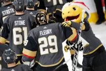 Vegas Golden Knights mascot Chance, right, congratulates Vegas Golden Knights goaltender Marc-A ...