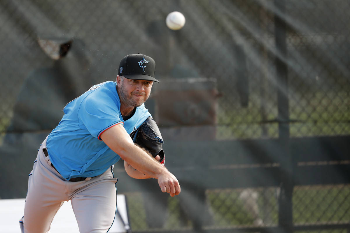 Miami Marlins pitcher Brandon Kintzler throws during spring training baseball practice Sunday, ...