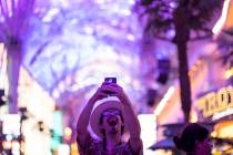 Las Vegas local Jess Medina takes an excited selfie as he visits Fremont Street Experience for ...
