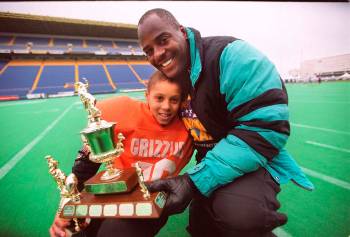 Former Blue Bomber Willard Reaves gives his son #38 Jordan Reaves a hug after his team the Cres ...