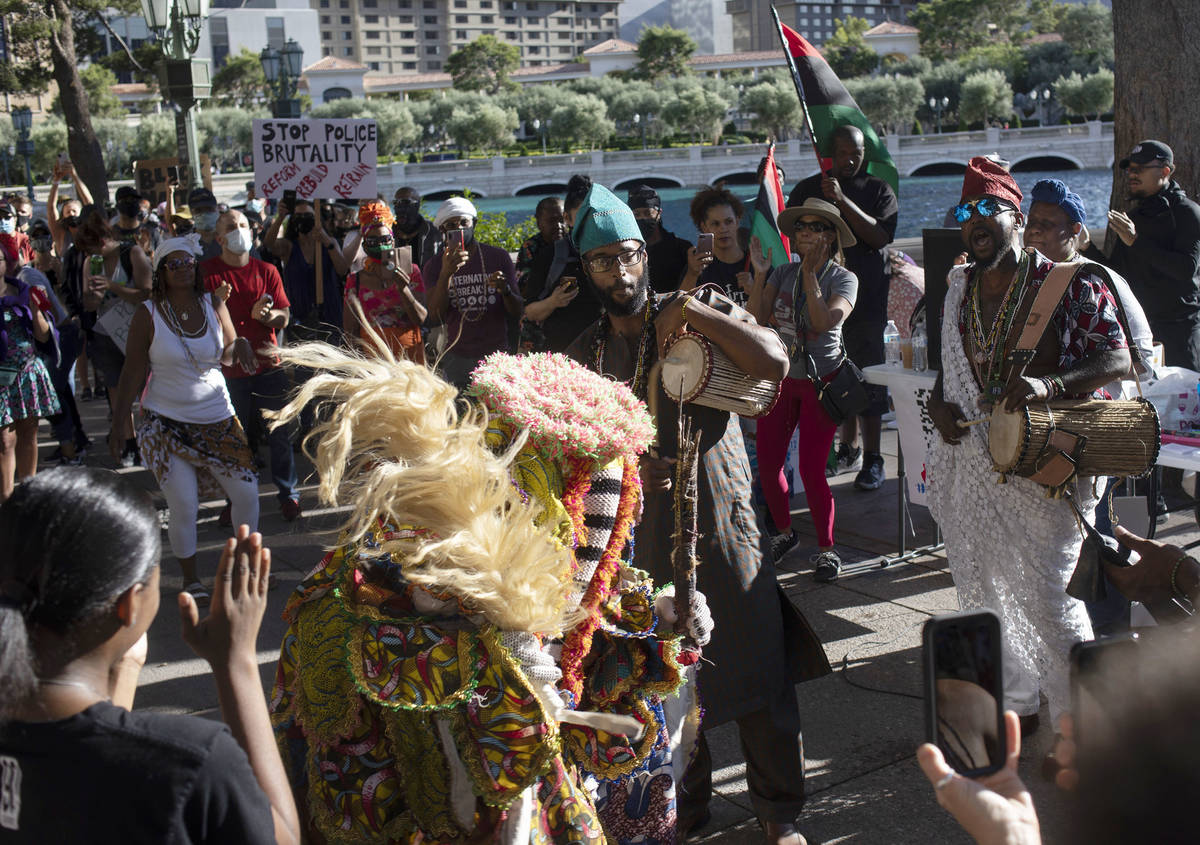 A group performs a traditional Nigerian dance as the protest against police brutality begins ou ...