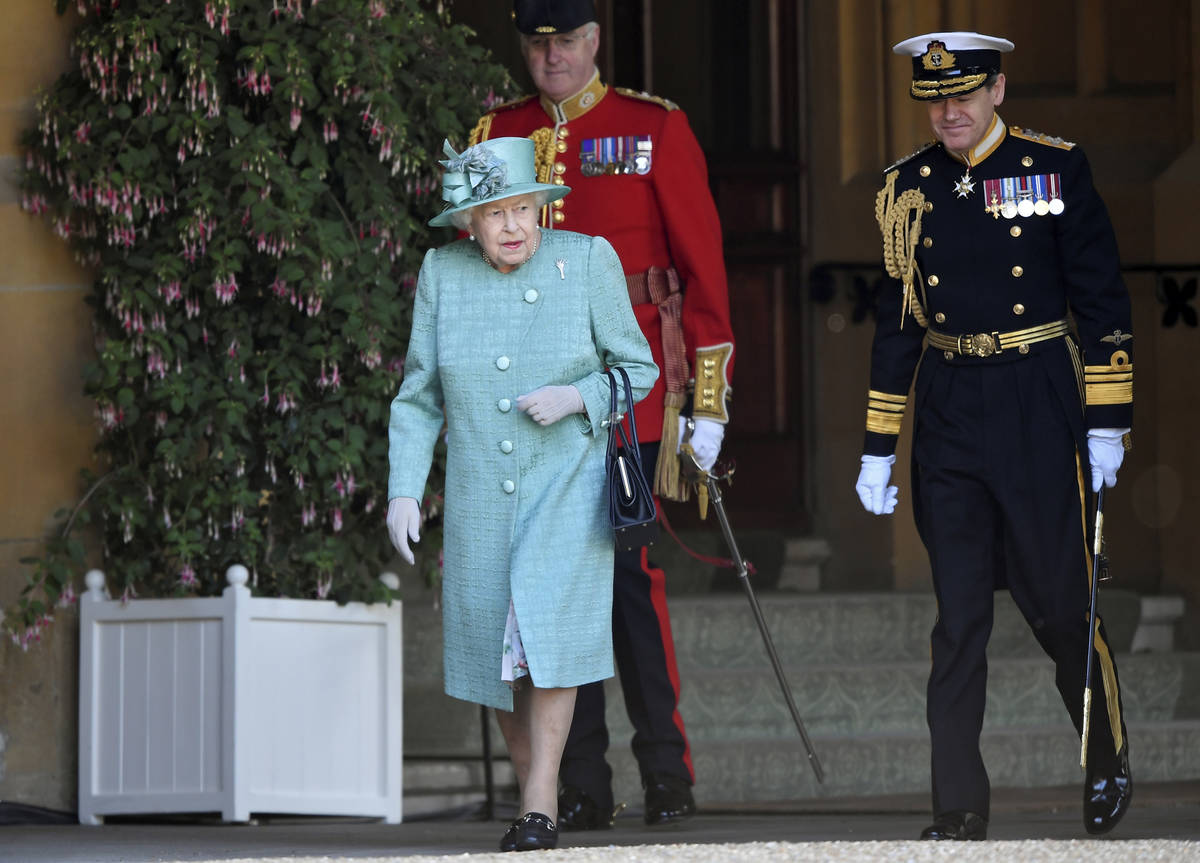 Britain's Queen Elizabeth II attends a ceremony to mark her official birthday at Windsor Castle ...