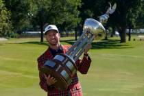 Daniel Berger poses with the championship trophy after winning the Charles Schwab Challenge gol ...
