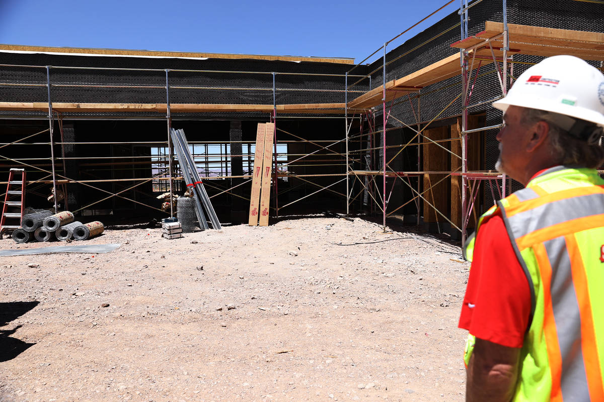 Project manager David Brown gives a tour of the construction of the first on-campus student hou ...