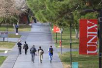 Students walk along a sidewalk at UNLV. (Review-Journal file photo)