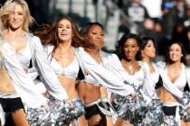 Oakland Raiders cheerleaders perform during the first half of an NFL football game between the ...