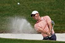 Rory McIlroy, of Northern Ireland, chips into the hole for a birdie on the 16th green during th ...