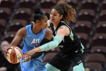Atlanta Dream's Alex Bentley is pressured by New York Liberty's Amanda Zahui B. Of Sweden durin ...