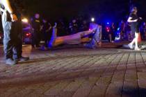 Police stand near a toppled statue of Jefferson Davis on Wednesday night, June 10, 2020, in Ric ...
