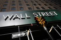 A sign for a Wall Street building is shown, Tuesday, June 16, 2020. Stocks are rising sharply i ...
