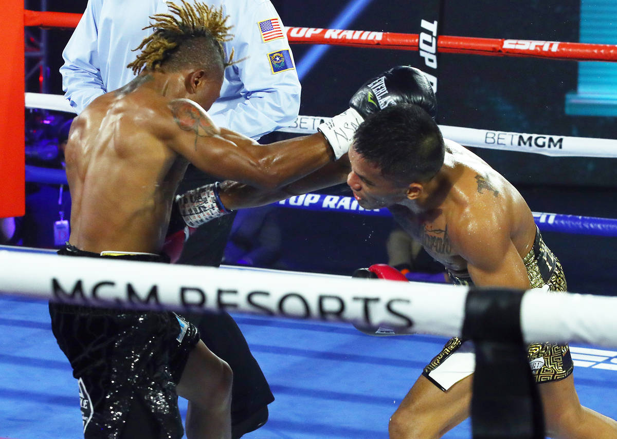 Joshua Greer Jr. (dark trunks) vs. Mike Plania inside the MGM Grand's Grand Ballroom on Tuesday ...