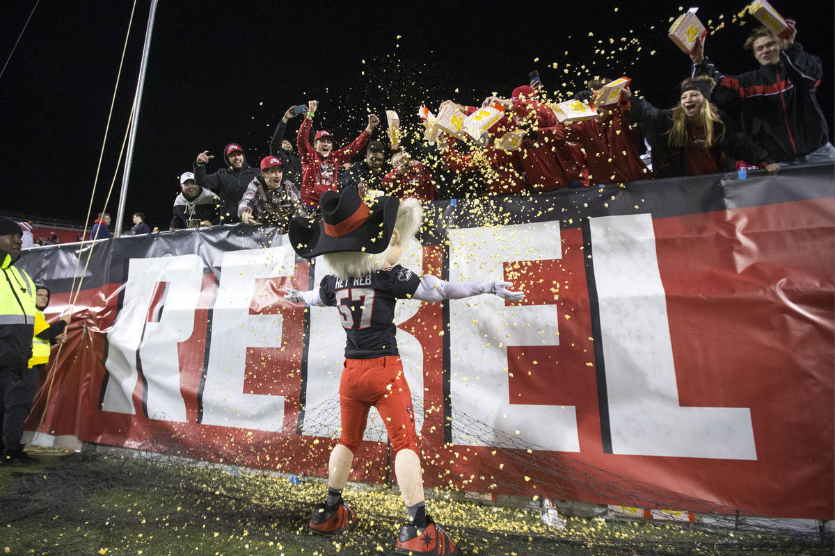 UNLV Rebels mascot Hey Reb! gets covered in popcorn by fans after Rebels quarterback Armani Rog ...