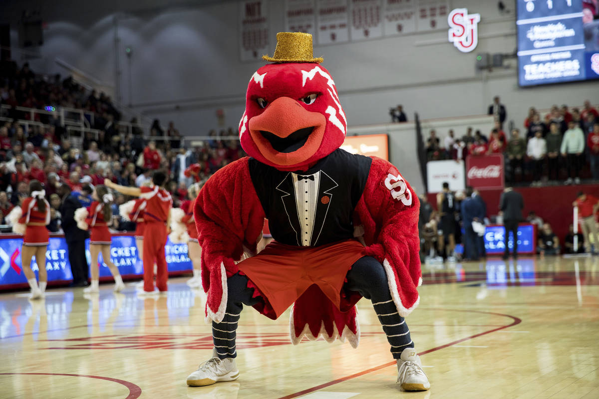 St. John's mascot Johnny Thunderbird rallies the crowd during a time out in the second half of ...