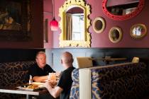 Andre Nelms, left, has lunch with Joe Giordano at Paymon's, a Mediterranean restaurant, in Las ...