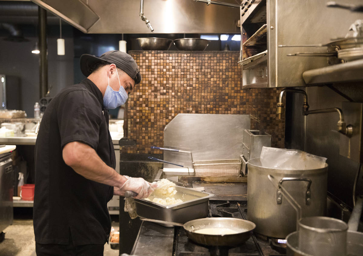 Jose Lopez works in the kitchen at 7th & Carson in Las Vegas, May 10, 2020. Restaurants hosted ...
