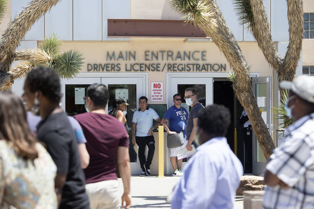 People wait in line at the Nevada Department of Motor Vehicles at 8250 W. Flamingo Road, which ...