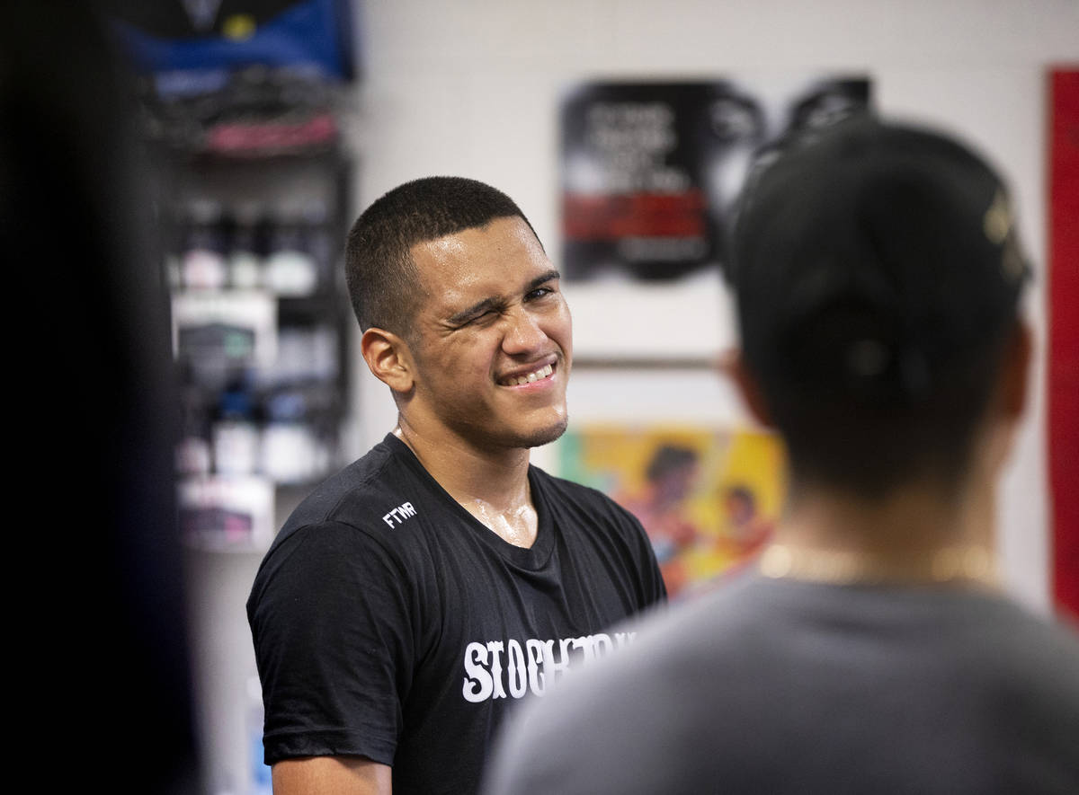 Gabe Flores Jr., left, jokes around with staff at Capetillo & TM Boxing on Saturday, June 1 ...