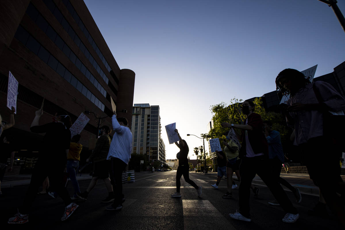 People participate in a Black Lives Matter protest along Las Vegas Boulevard on Wednesday, June ...