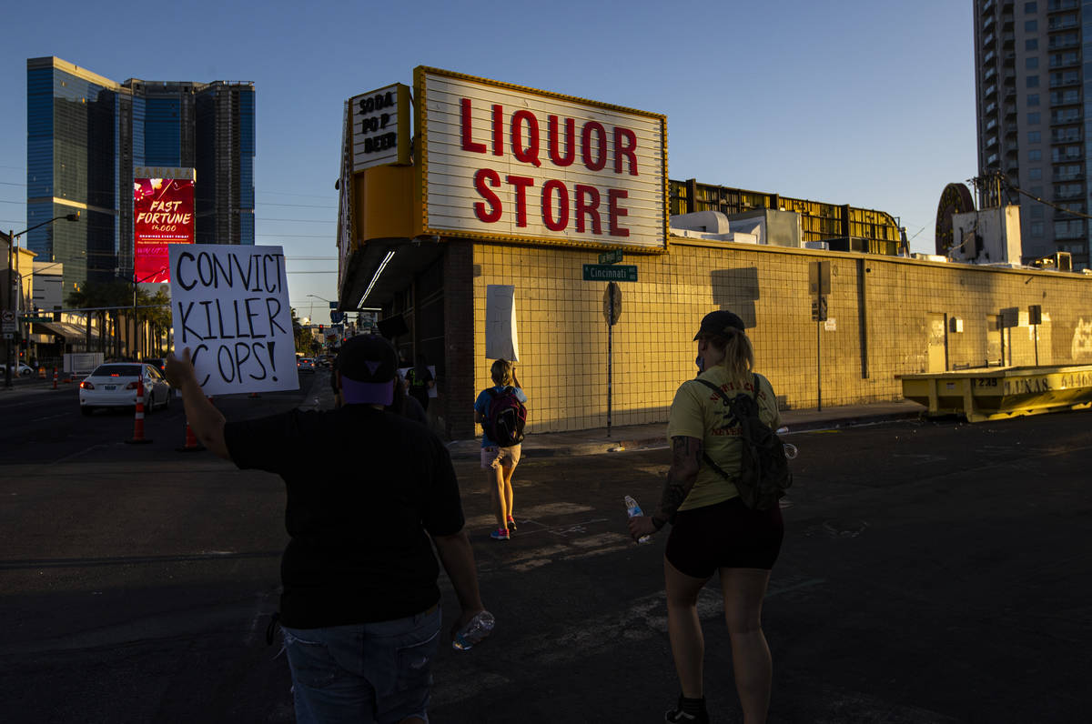 People participate in a Black Lives Matter protest along Las Vegas Boulevard on Wednesday, June ...