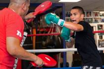 Gabe Flores Jr., right, works out with his trainer and father Gabriel Flores Sr. at Capetillo & ...