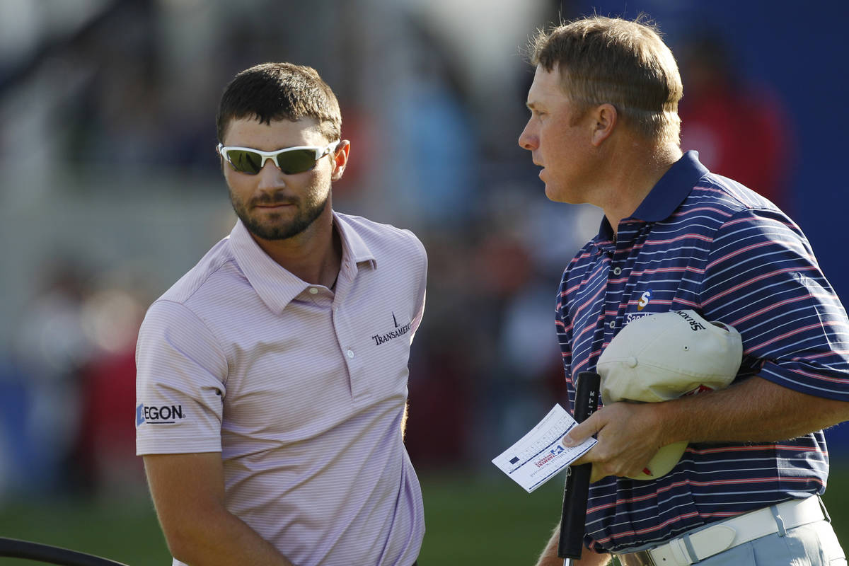 Kyle Stanley is consoled by John Rollins, right, after making a triple bogey on the 18th hole ...