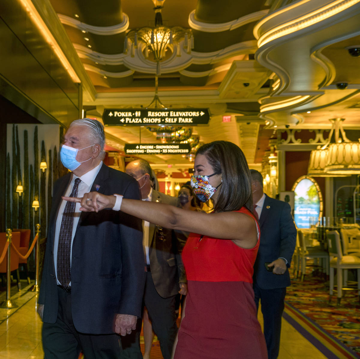 Gov. Steve Sisolak walks beside Sandra Morgan, chairwoman of the Nevada Gaming Control Board, a ...