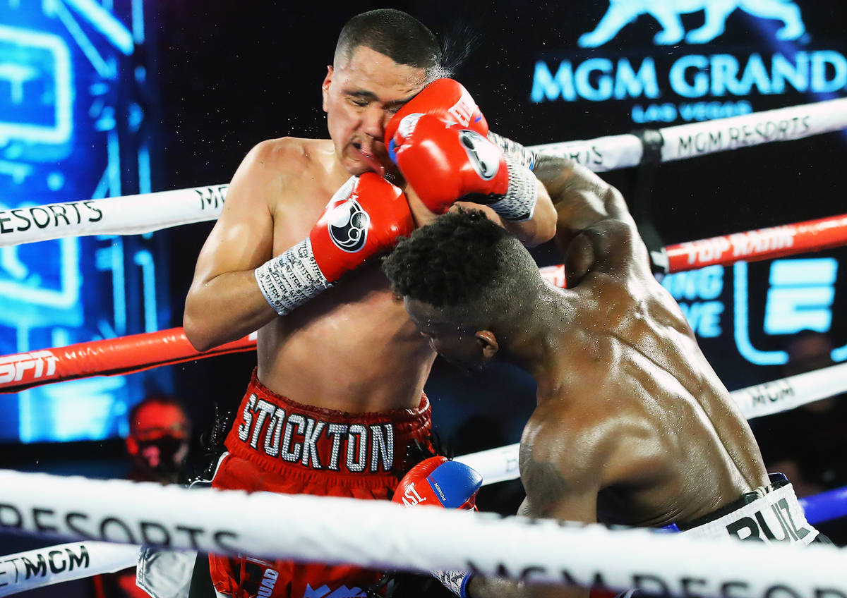 Josec Ruiz, right, connects with a punch against Gabriel Flores Jr. during their lightweight fi ...