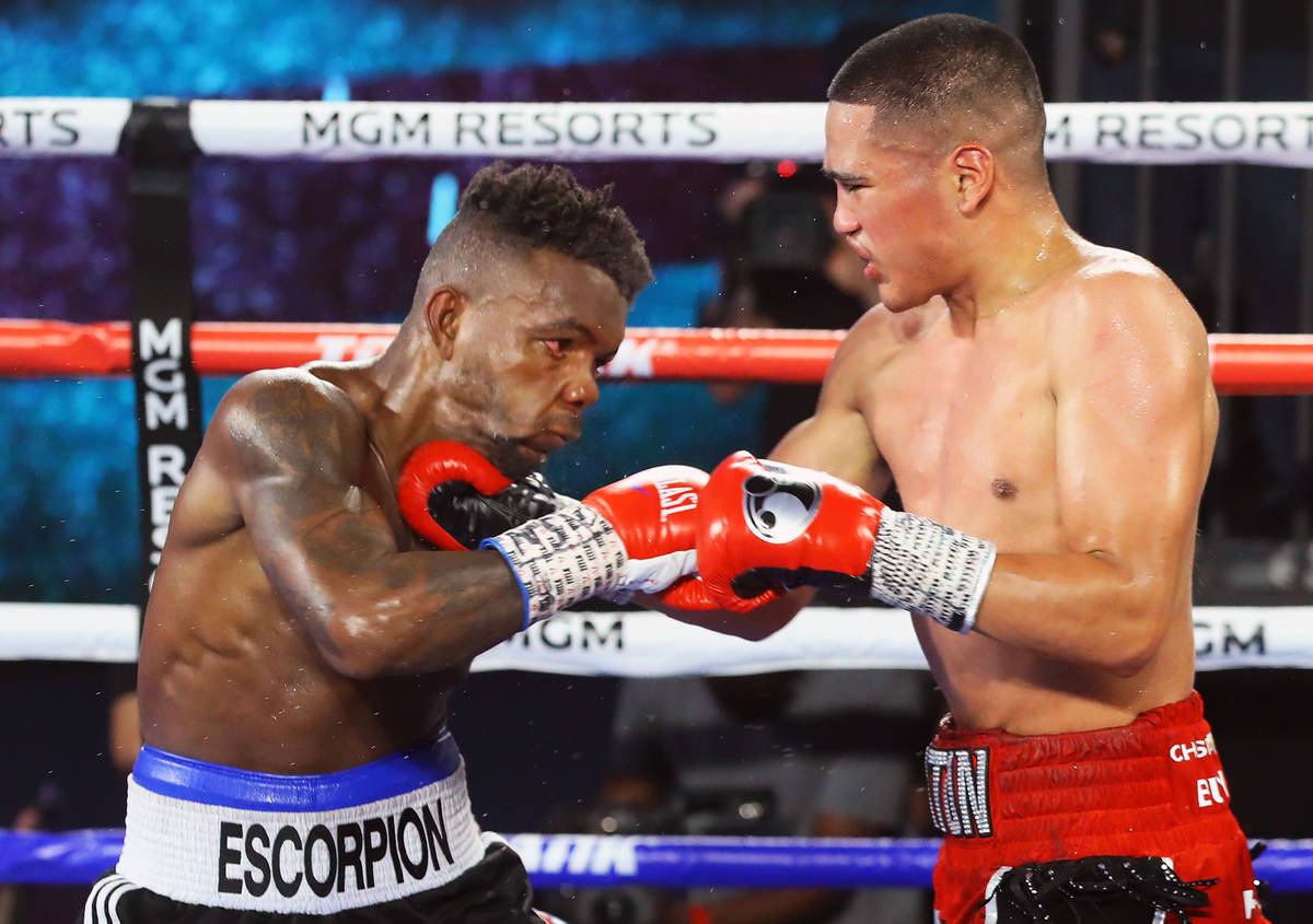 Gabriel Flores Jr., right, lands a punch against Josec Ruiz during their lightweight fight Thur ...