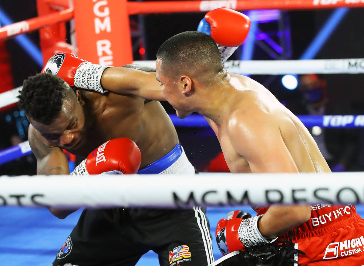 Gabriel Flores Jr., right, lands a punch against Josec Ruiz during their lightweight fight Thur ...